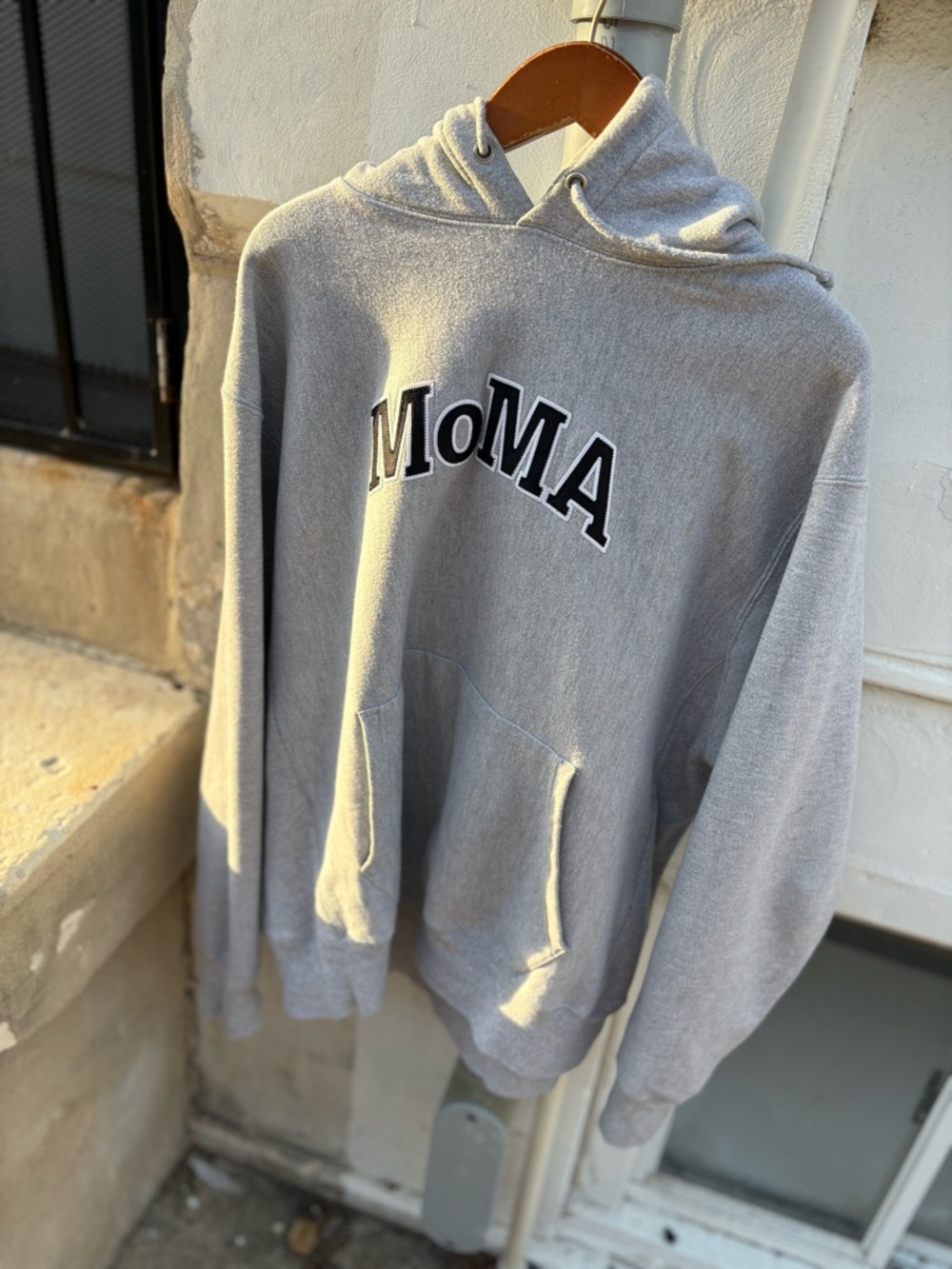 Moma Light Gray Pullover Hoodie with Bold Logo